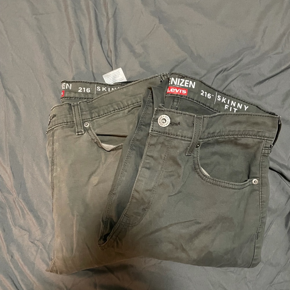 Two pairs of Levi grey jeans